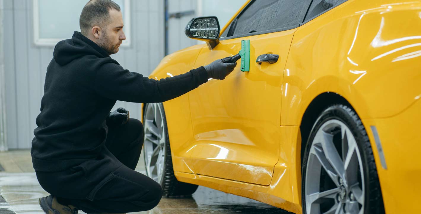 Yellow car with ceramic coating applied for glossy and scratch-resistant finish